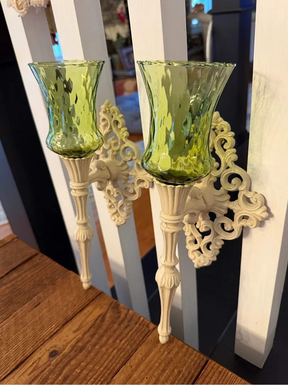 (2) vintage cast metal candle wall sconces paired with green glass votive cups